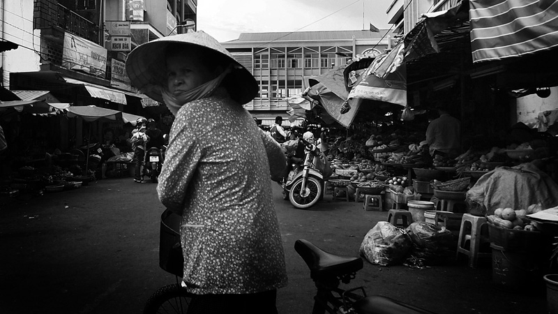 Old lady with her bike